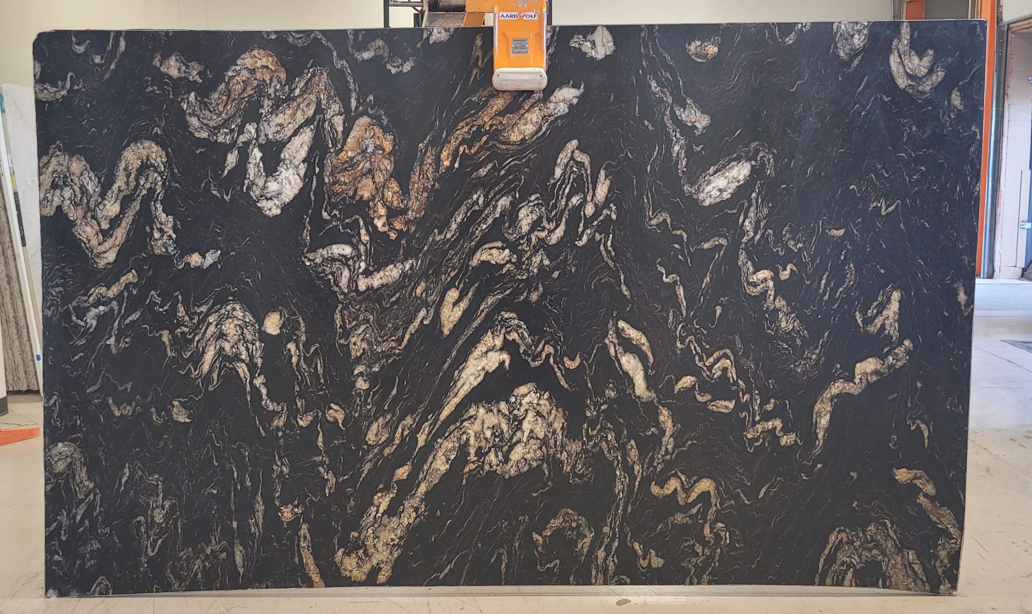 Titanium Gold Leathered Granite granite, leathered finish — full slab at StoneX USA, West Allis WI