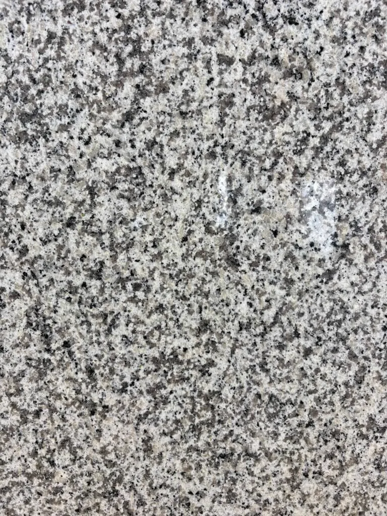 Fortaleza Polished Granite slab, white granite with polished finish, close surface and finish detail, West Allis, WI near Milwaukee