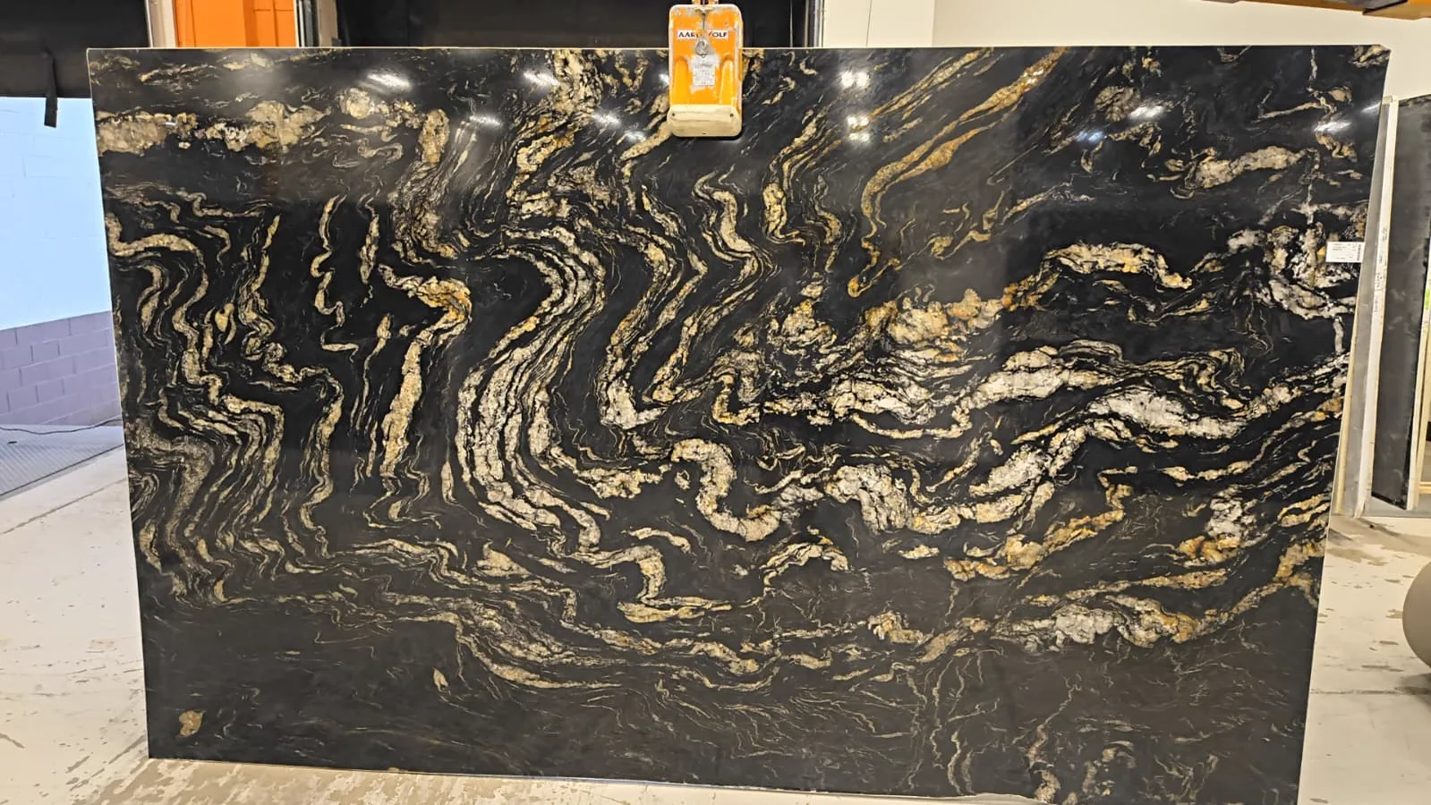 Titanium Gold Polished Granite slab, black granite with polished finish, full slab at StoneX USA, West Allis, WI near Milwaukee