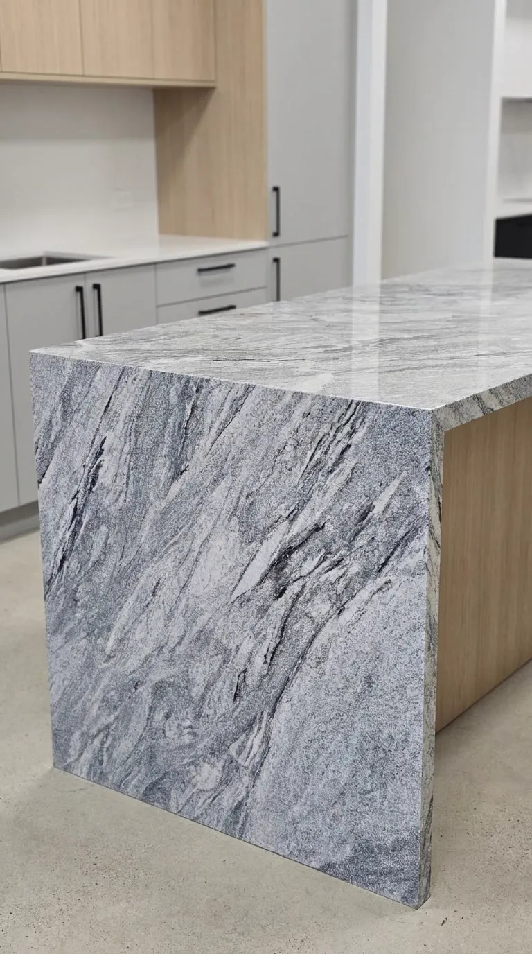 Viscon White Polished granite slab — Fabricated as a kitchen island with a waterfall end | StoneX USA, West Allis WI