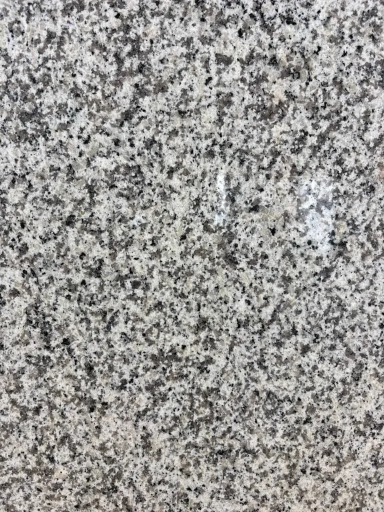 Fortaleza Polished Granite slab, white granite with polished finish, close surface and finish detail, West Allis, WI near Milwaukee