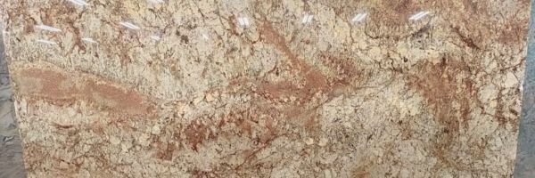 Typhoon Bordeaux polished granite slab with burgundy and cream movement, full slab at StoneX USA, West Allis WI