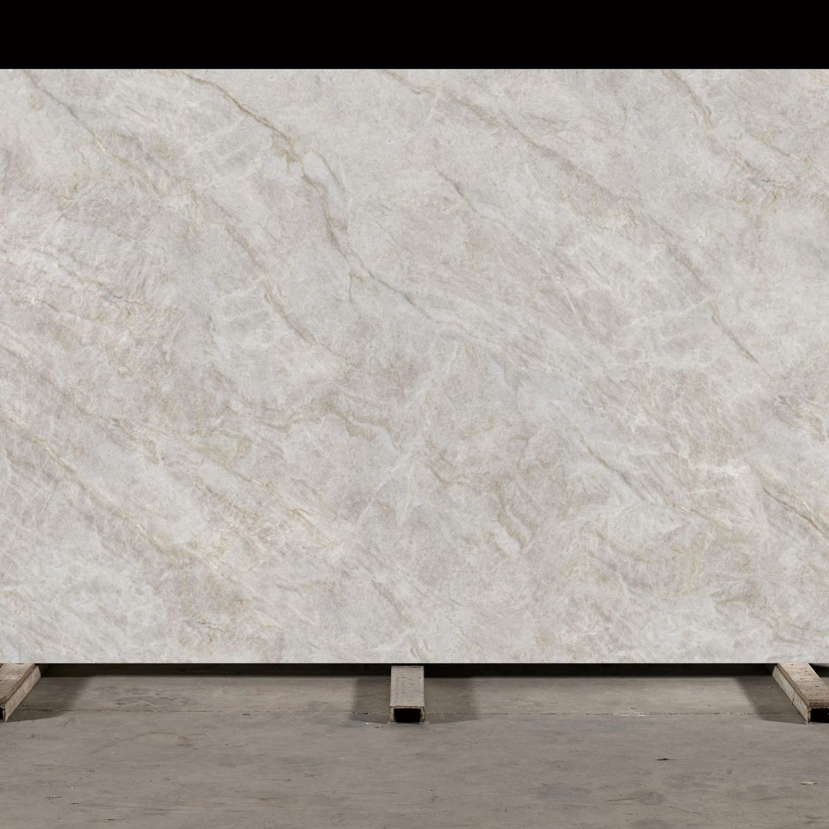 Taj Mahal Polished engineered quartz slab with warm cream and caramel veining, veining detail, StoneX USA slab gallery near Milwaukee
